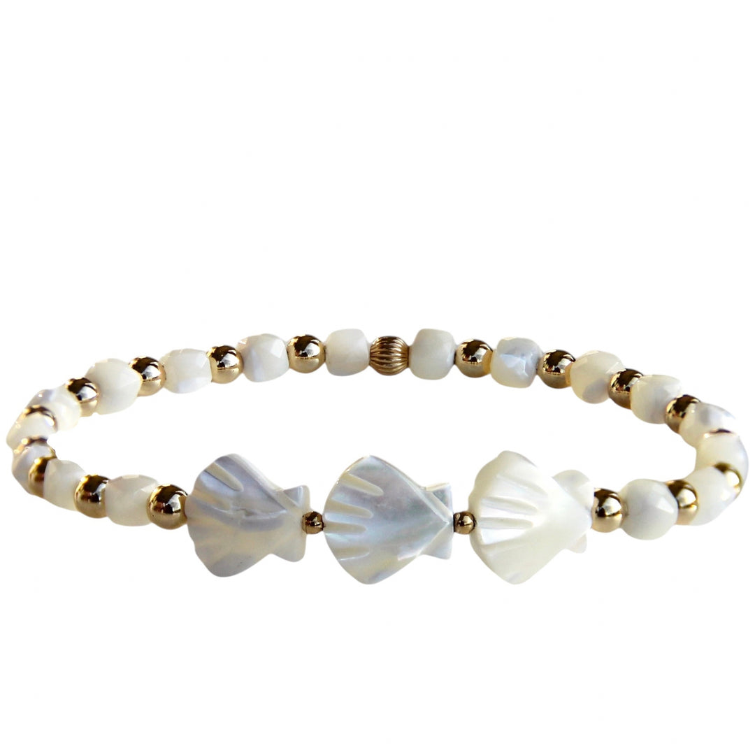 Handcrafted bracelet featuring luminous shell beads and gold accents, inspired by the ocean’s beauty and designed for free-spirited, salty souls who love the sea