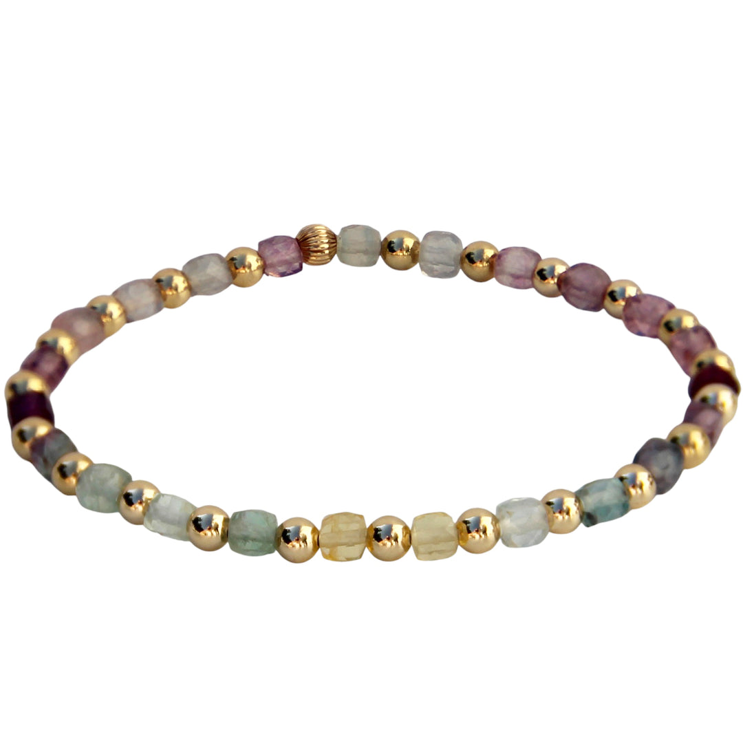 A handcrafted bracelet featuring colorful Fluorite cube gemstones paired with gold bead accents, creating a vibrant and boho design.