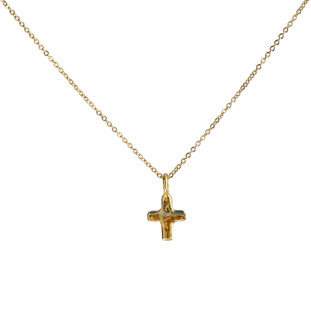 Delicate Tiny Cross Necklace in gold, featuring a minimalist organic design with a petite cross pendant on a delicate chain, styled against a white background.