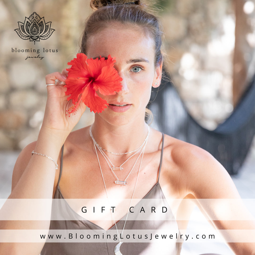 A woman with a red hibiscus flower covering one eye, wearing layered necklaces and a bracelet, representing Blooming Lotus Jewelry. Text overlay reads "Gift Card" and "www.BloomingLotusJewelry.com" with the brand's logo in the top left corner.