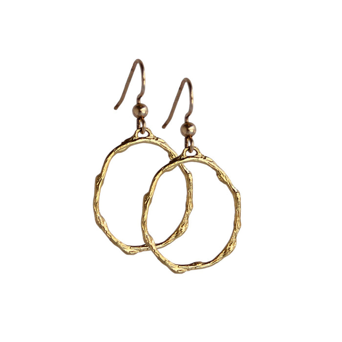 Pair of small gold hoop earrings with a branch-inspired texture, designed in an elongated loop shape