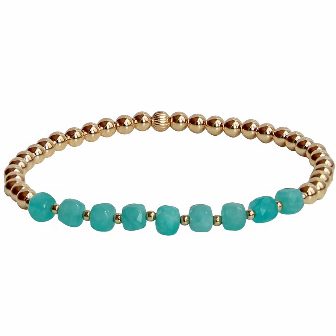 Gold beaded stretch bracelet featuring faceted Amazonite gemstones in a vibrant turquoise hue. A coastal-inspired piece that brings a refreshing, oceanic vibe to any jewelry stack.