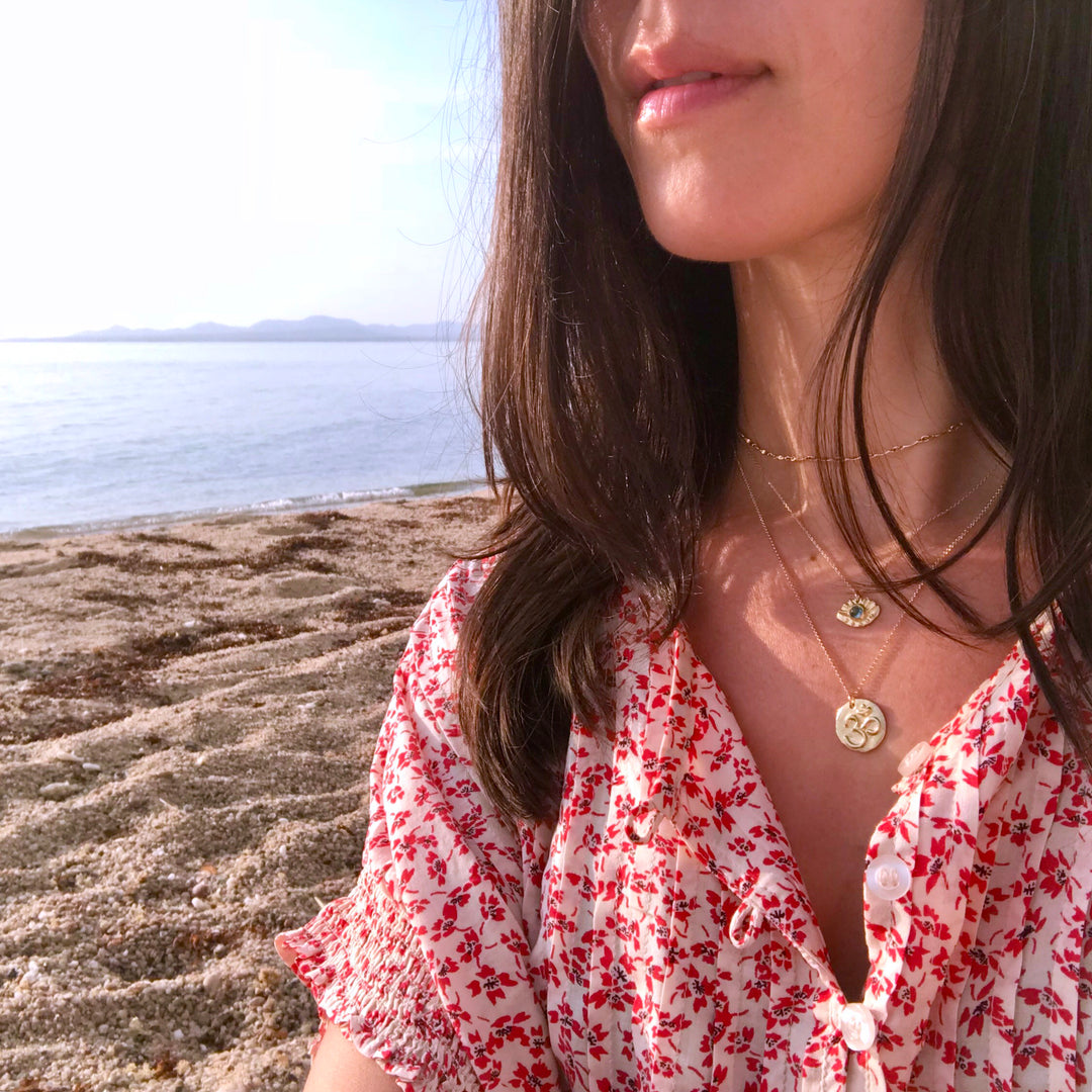 Gold Twinkle Chain choker layering chains on model at beach - Blooming Lotus Jewelry