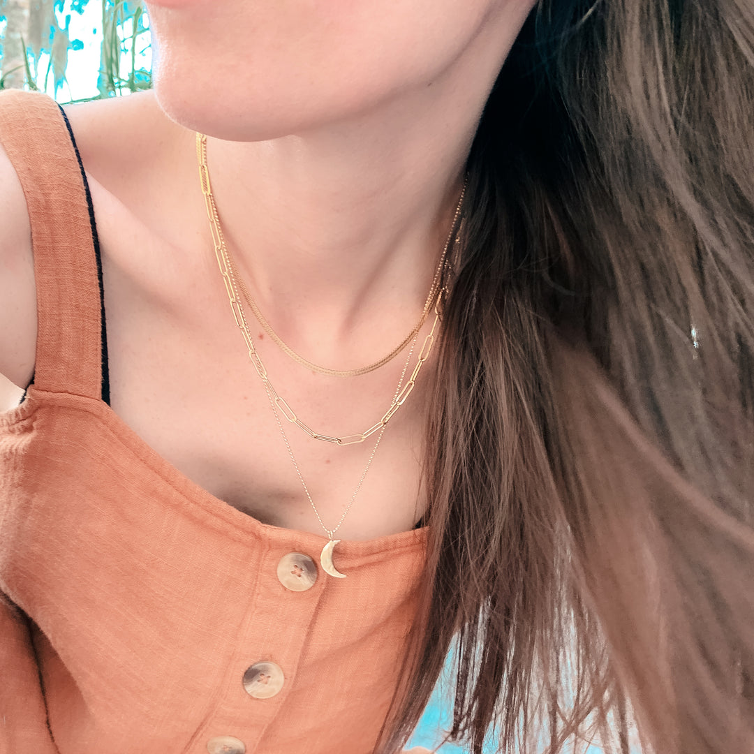 Model wearing gold layering necklaces - Paperclip, Herringbone, Luna Necklace Chains - Blooming Lotus Jewelry