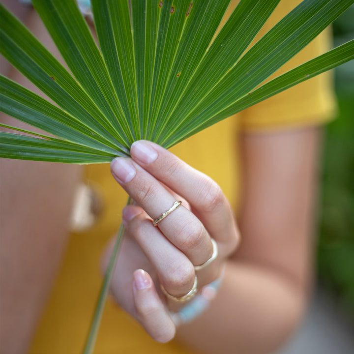 Skinny Olive Branch Ring gold stacking ring model close up Blooming Lotus Jewelry