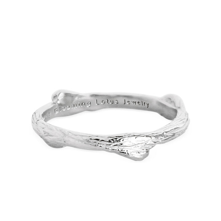 Delicate silver ring resembling a slender olive branch, crafted with intricate twig-like details and engraved with 'Blooming Lotus Jewelry' on the inner band.