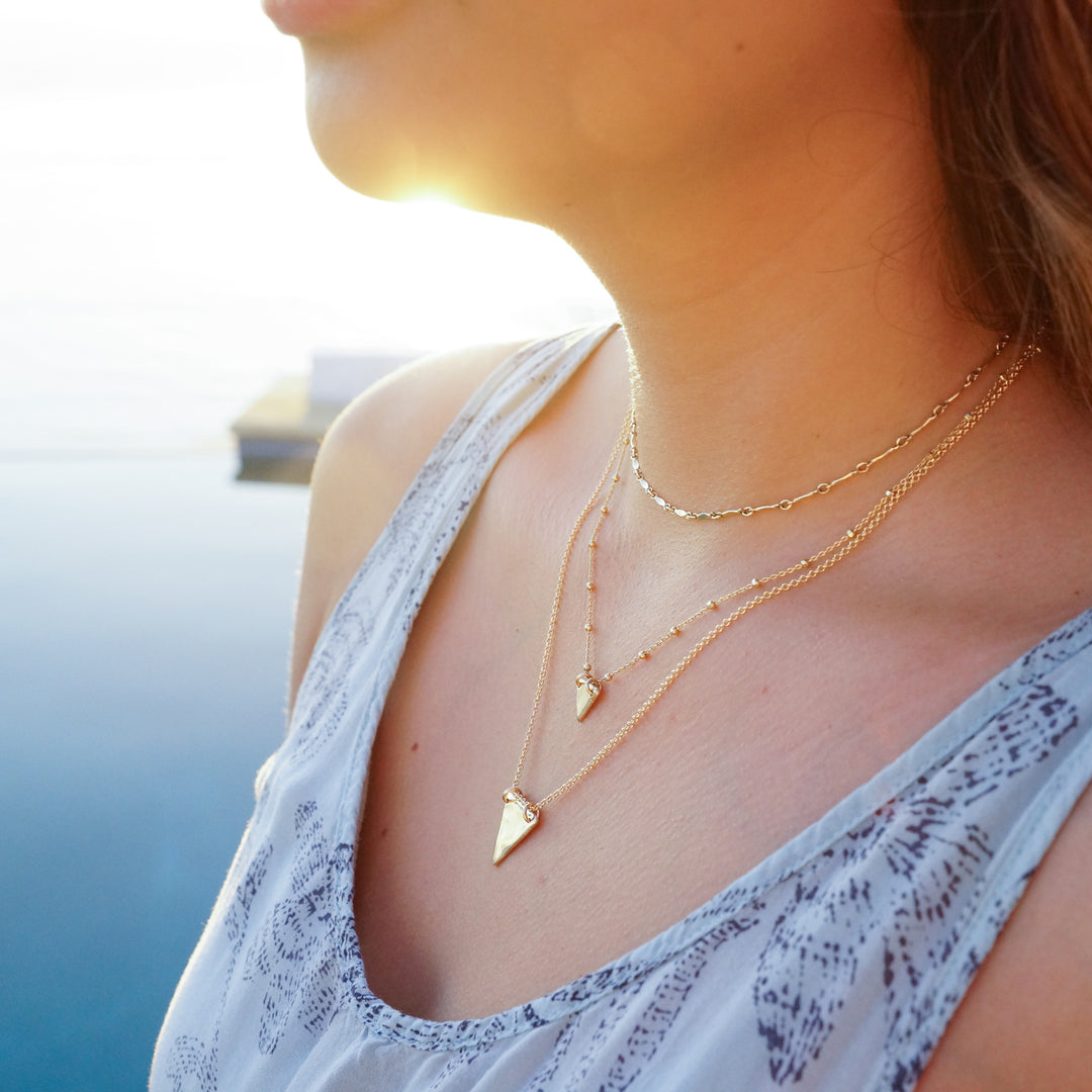 Gold Twinkle Choker necklace - layering chains on model - Blooming Lotus Jewelry