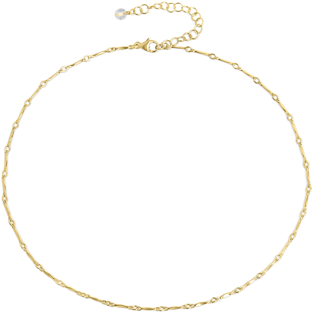 A delicate gold choker necklace with minimalist chain links featuring tiny, twinkling details. The adjustable clasp and extender chain provide a customizable fit, making it perfect for layering or wearing solo. By Blooming Lotus Jewelry