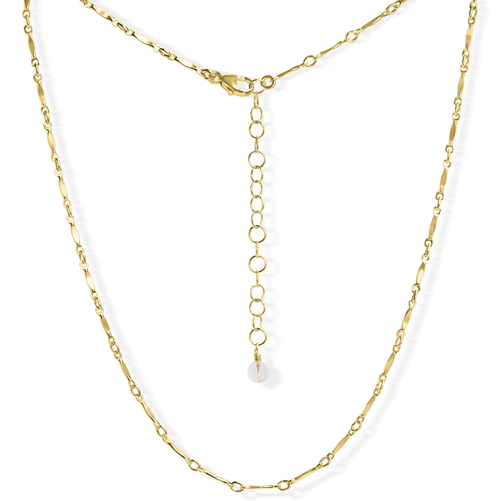 Delicate gold Twinkle choker necklace with minimalist chain links featuring tiny, twinkling details. The adjustable clasp and extender chain provide a customizable fit, making it perfect for layering or wearing solo. By Blooming Lotus Jewelry