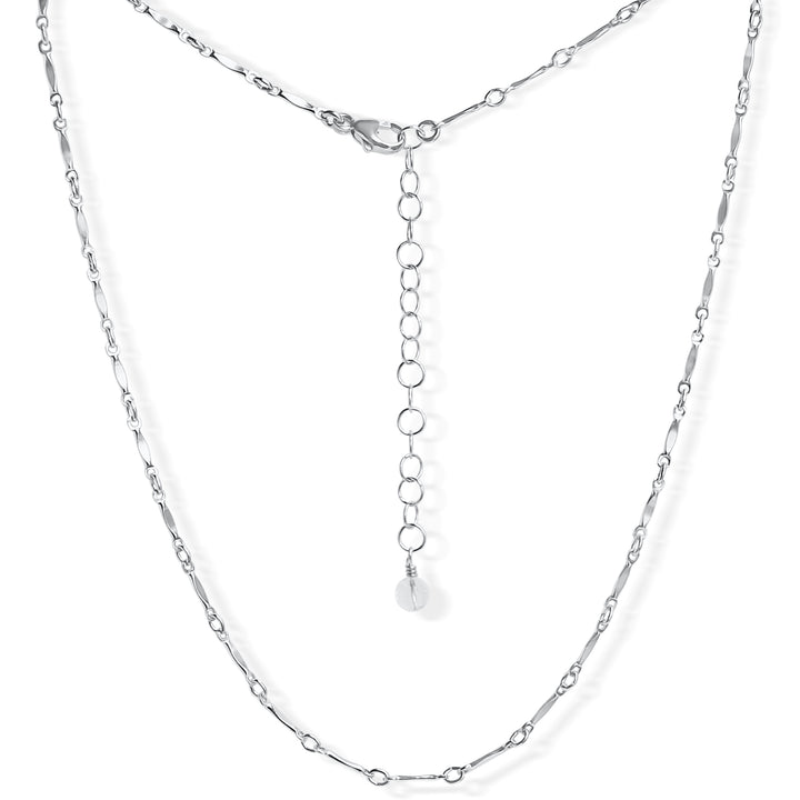 Delicate silver Twinkle choker necklace with minimalist chain links featuring tiny, twinkling details. The adjustable clasp and extender chain provide a customizable fit, making it perfect for layering or wearing solo. 